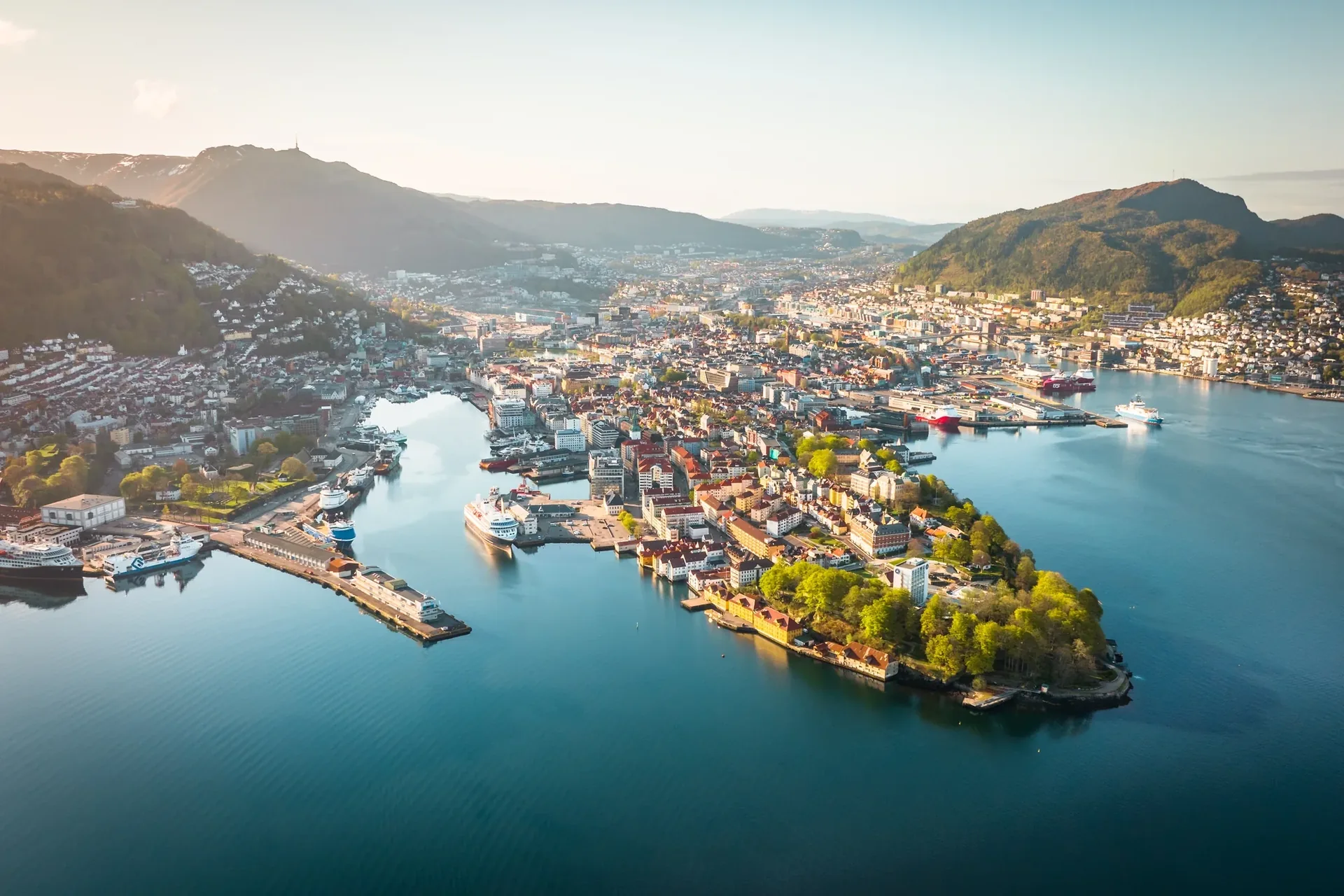 Aerial view of Bergen and its harbor surrounded by mountains