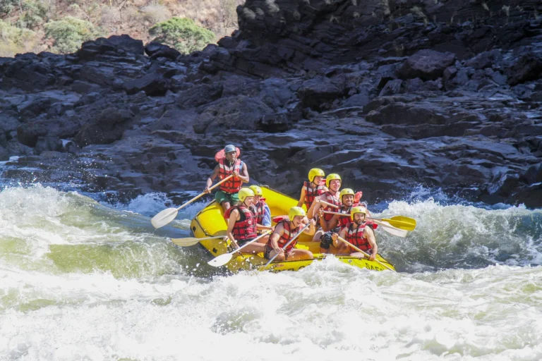 Rafters navigating whitewater rapids on the Zambezi River