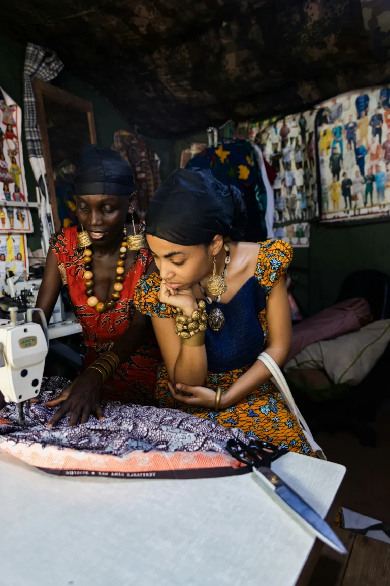 Artisans working together on fabric at the Wayawaya workshop