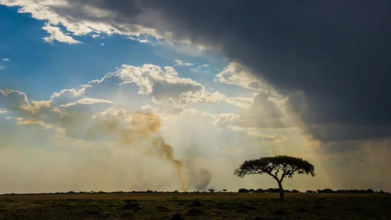 Sunlight breaking through clouds over the Zambian landscape